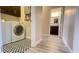 Convenient laundry area with modern washer and dryer, stylish flooring, and easy access to an adjacent bathroom at 7460 Highway 101 N, Rockmart, GA 30153