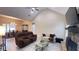 Spacious living room with a stone fireplace, large windows, and open access to the dining area at 7460 Highway 101 N, Rockmart, GA 30153