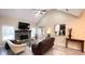 A cozy living room is enhanced by a stone fireplace and comfortable furniture, inviting relaxation at 7460 Highway 101 N, Rockmart, GA 30153