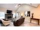 Bright living room featuring a stone fireplace, large windows, and modern furnishings at 7460 Highway 101 N, Rockmart, GA 30153