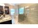 Luxurious bathroom featuring a seamless glass shower, granite countertops, and a soaking tub at 7460 Highway 101 N, Rockmart, GA 30153
