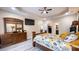 Well-lit bedroom showcases wood flooring, a dresser, and access to the bathroom and walk-in closet at 7460 Highway 101 N, Rockmart, GA 30153