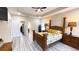Spacious bedroom includes a stylish bed, a ceiling fan, and ensuite bath access at 7460 Highway 101 N, Rockmart, GA 30153