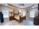 Comfortable main bedroom features trey ceilings, neutral paint, and a ceiling fan at 7460 Highway 101 N, Rockmart, GA 30153