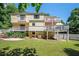 Multi-level home featuring spacious backyard and multiple wooden decks perfect for outdoor relaxation and entertaining at 1202 Laurel Cliff Se Dr, Smyrna, GA 30082