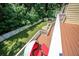 Scenic view of a backyard from a wood deck, featuring lush lawn and fencing at 1202 Laurel Cliff Se Dr, Smyrna, GA 30082