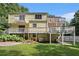 A large backyard with a multi-level deck that adds outdoor living space to this house at 1202 Laurel Cliff Se Dr, Smyrna, GA 30082