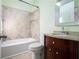 Bathroom featuring a shower-tub combination and a vanity with a granite top at 1202 Laurel Cliff Se Dr, Smyrna, GA 30082