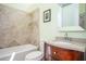 Cozy bathroom featuring tub, tiled walls, and vanity with granite countertop at 1202 Laurel Cliff Se Dr, Smyrna, GA 30082