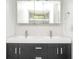 Elegant bathroom featuring a double sink vanity, modern fixtures and a stylish hexagon tile backsplash at 1202 Laurel Cliff Se Dr, Smyrna, GA 30082