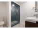 Modern bathroom with glass shower, tile surround, contemporary sink, and tile floors at 1202 Laurel Cliff Se Dr, Smyrna, GA 30082