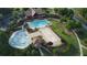 Aerial view of community pool, splashpad, clubhouse surrounded by trees at 3530 Ridge Hill Pkwy, Douglasville, GA 30135