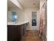 The bathroom has a wood vanity, large mirror, modern fixtures, and wood-look floors at 3530 Ridge Hill Pkwy, Douglasville, GA 30135