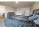 Comfortable bedroom with soft carpet, a large bed, and gray furnishings at 3530 Ridge Hill Pkwy, Douglasville, GA 30135