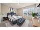 Bright bedroom with a large window, stylish decor, soft carpet, and coordinated furniture at 3530 Ridge Hill Pkwy, Douglasville, GA 30135