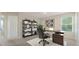 Well-appointed home office with desk, shelving, decor, and carpet flooring, creating a professional workspace at 3530 Ridge Hill Pkwy, Douglasville, GA 30135