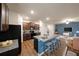 Open kitchen with a central island, granite countertops, dark brown cabinets, and stainless steel appliances at 3530 Ridge Hill Pkwy, Douglasville, GA 30135
