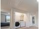 Bright laundry room features a washer, dryer, and convenient overhead shelving for storage at 3530 Ridge Hill Pkwy, Douglasville, GA 30135