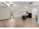 Open-concept living area with hardwood floors, seamlessly connecting the kitchen and a cozy seating area at 3530 Ridge Hill Pkwy, Douglasville, GA 30135