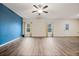 Bright, open living room with laminate flooring and large windows for natural light at 3530 Ridge Hill Pkwy, Douglasville, GA 30135