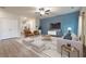 Comfortable living room featuring a blue accent wall and stylish furnishings at 3530 Ridge Hill Pkwy, Douglasville, GA 30135