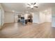 Open-concept living space featuring laminate floors, a kitchen island, and modern appliances at 3530 Ridge Hill Pkwy, Douglasville, GA 30135