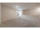 Cozy loft space with carpeting, a window, and an access door, offering a quiet retreat at 3530 Ridge Hill Pkwy, Douglasville, GA 30135