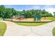 Community playground with swings and climbing equipment surrounded by green space at 3530 Ridge Hill Pkwy, Douglasville, GA 30135