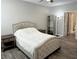 Bright bedroom with an upholstered headboard, wood-look floors, and natural light at 5641 Roswell Rd # 111, Sandy Springs, GA 30342