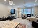 Bright living area featuring neutral tones, large windows, and modern furnishings at 5641 Roswell Rd # 111, Sandy Springs, GA 30342
