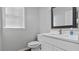 Charming bathroom with white vanity, modern fixtures, and ample natural light at 3525 Elder Field Ln, Cumming, GA 30040