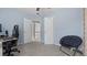 Bedroom features light walls, gray carpet, custom built in shelves and work space at 3525 Elder Field Ln, Cumming, GA 30040