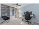 Bedroom features light walls, gray carpet, custom built in shelves and work space at 3525 Elder Field Ln, Cumming, GA 30040