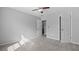 Bedroom featuring light walls, gray carpet, ceiling fan and natural light at 3525 Elder Field Ln, Cumming, GA 30040