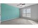 Bedroom featuring light walls, gray carpet, ceiling fan and natural light at 3525 Elder Field Ln, Cumming, GA 30040