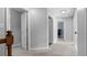 Upstairs hallway featuring neutral walls, gray carpet and white trim throughout at 3525 Elder Field Ln, Cumming, GA 30040