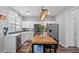 Bright kitchen with white cabinets, stainless appliances, and butcher block island at 3525 Elder Field Ln, Cumming, GA 30040