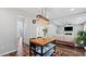 Open kitchen with an island flowing into the living room for easy entertaining at 3525 Elder Field Ln, Cumming, GA 30040