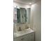 Updated bathroom vanity with ample storage, sink, and large mirror at 402 Hancock Ct, Woodstock, GA 30188