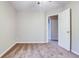This cozy bedroom is carpeted and features neutral tones and natural light at 402 Hancock Ct, Woodstock, GA 30188