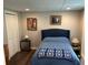 Cozy bedroom with closet, and a comfortable bed with a blue comforter at 402 Hancock Ct, Woodstock, GA 30188