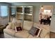 Comfortable living room with decorative pillows and open access to kitchen and dinette at 402 Hancock Ct, Woodstock, GA 30188