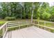 Spacious back deck providing a tranquil view of the expansive and private backyard at 4171 Whispering Forest Sw Ct, Lilburn, GA 30047