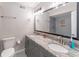 Bathroom with double sink vanity, granite countertops, and a walk-in shower at 4171 Whispering Forest Sw Ct, Lilburn, GA 30047