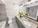 Bathroom boasts double sink vanity, modern finishes, and ample counter space at 4171 Whispering Forest Sw Ct, Lilburn, GA 30047