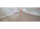 Bedroom featuring light wood-look flooring, neutral walls, and a closet at 4171 Whispering Forest Sw Ct, Lilburn, GA 30047