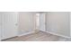 Bedroom featuring light wood-look flooring, neutral walls, and a closet at 4171 Whispering Forest Sw Ct, Lilburn, GA 30047