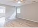Spacious bedroom with hardwood floors, a ceiling fan, and a view into an adjoining room at 4171 Whispering Forest Sw Ct, Lilburn, GA 30047