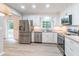 Updated kitchen with stainless steel appliances and natural light at 4171 Whispering Forest Sw Ct, Lilburn, GA 30047