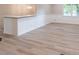Well-lit living room features new floors and white wainscoting at 4171 Whispering Forest Sw Ct, Lilburn, GA 30047